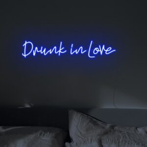 blue drunk in love neon light above the bed