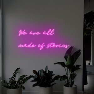 we are all made of stories pink neon sign