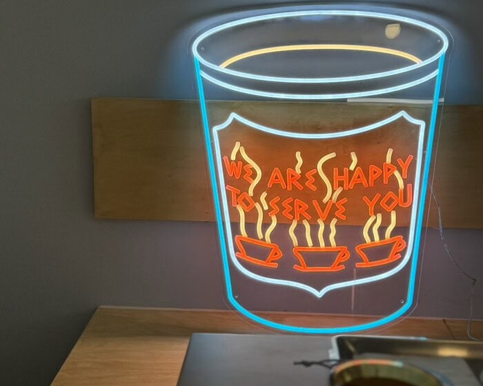 We Are Happy To Serve You paper coffee cup neon sign