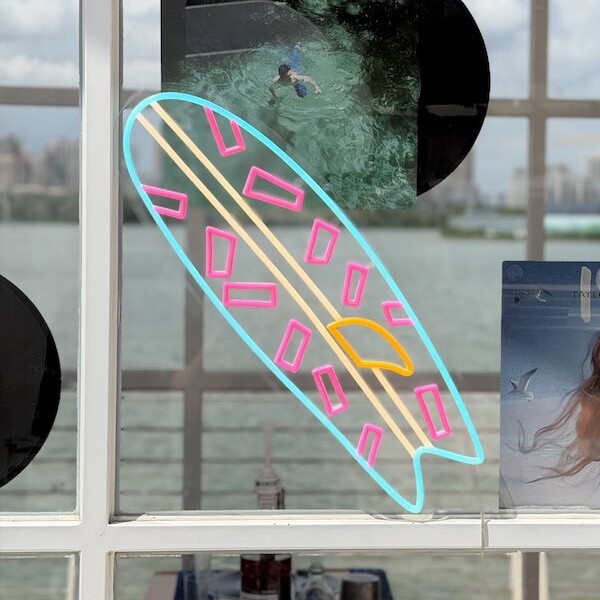 surf board neon sign beach vibe